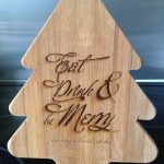 christmas tree shaped chopping board engraved with 'eat drink and be merry'